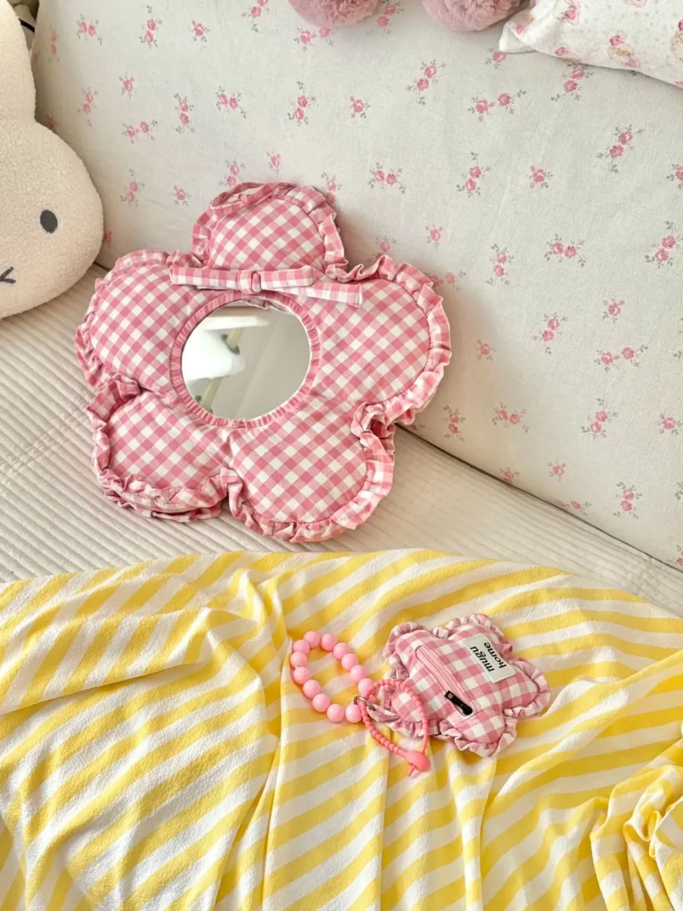 Blossom pink plaid framed mirror hanging on a bedroom wall